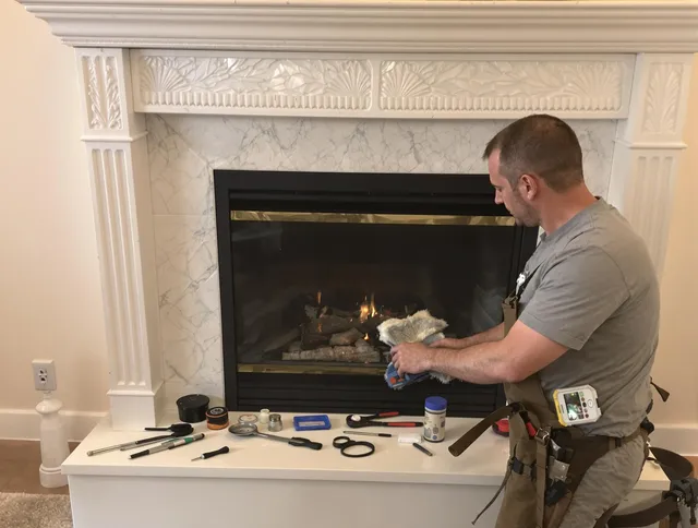 Southborough Chimney Sweep performing fireplace maintenance in Southborough, MA