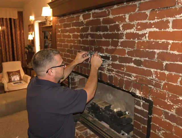 Southborough Chimney Sweep expert fixing a fireplace in Southborough, MA
